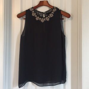 Sheer navy top with silver embroidery.